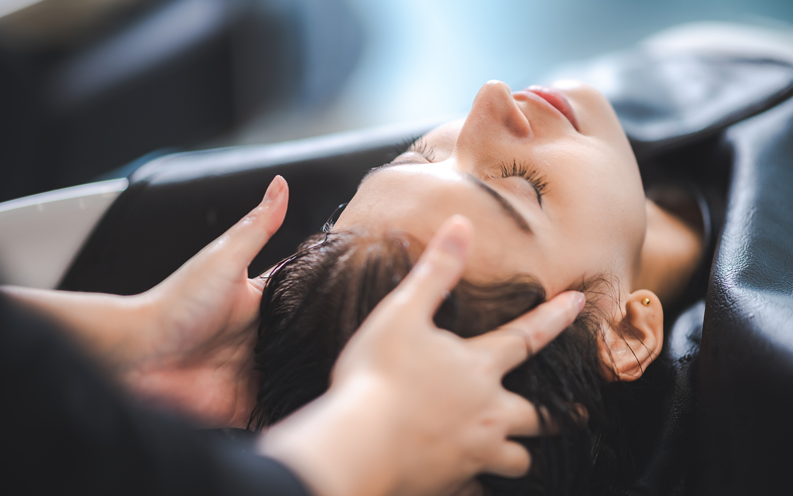 Refresh, Revive, Transform: The New Client Colour Experience - Customer getting a head massage at a salon
